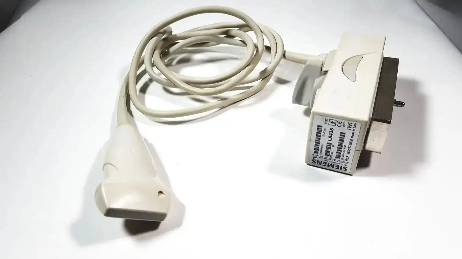 Beige siemens la435 transducer probe with coiled cable and rectangular connector for acuson p300 portable ultrasound