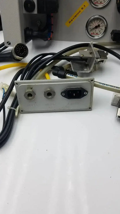 Silver metal Siemens LOGO 230rc 6ed1 052-1fb00-0ba4 power distribution panel with three circular ports and rectangular socket