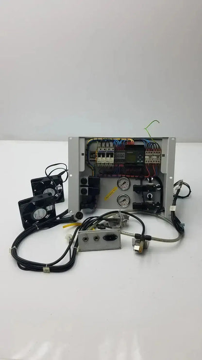 Industrial control panel with exposed wiring, gauges, and black fans in metallic Siemens LOGO 230rc 6ed1 052-1fb00-0ba4 housing