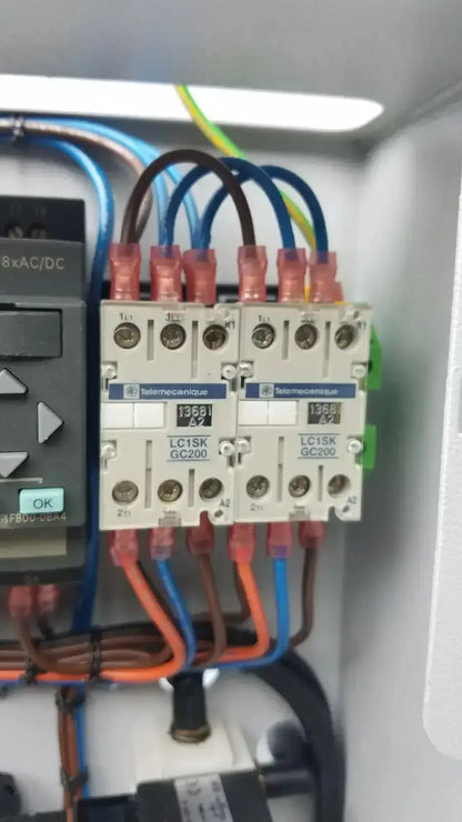 White telemecanique lc15k gc200 contactors with red terminal caps and color-coded wiring in siemens logo 230rc 6ed1 052-1fb00-0ba4 panel