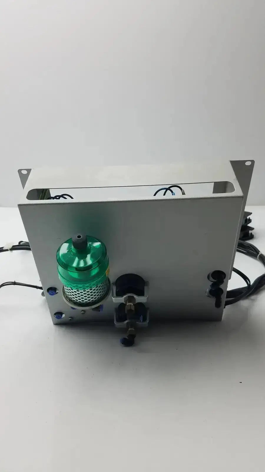 Silver metallic siemens logo 230rc 6ed1 052-1fb00-0ba4 industrial control unit with green translucent cylinder and black wiring