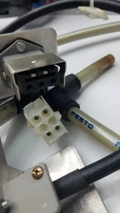Siemens logo 230rc 6ed1 052-1fb00-0ba4 with white plastic connector with four gold pins and festo black cable attached