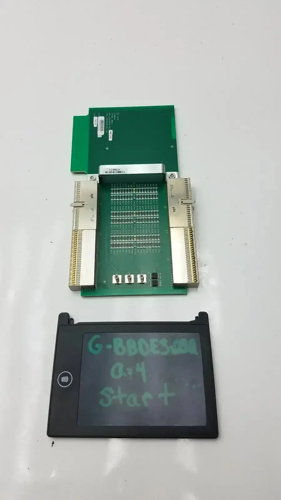 Black rectangular digital display with handwritten green text and circular button on siemens sc2000 ultrasound mp extender board