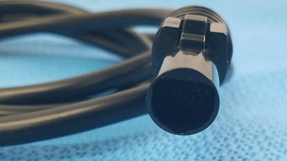 Black coiled SJM St Jude Medical diagnostic connection cable with metallic ridged locking connector for reuse medical equipment