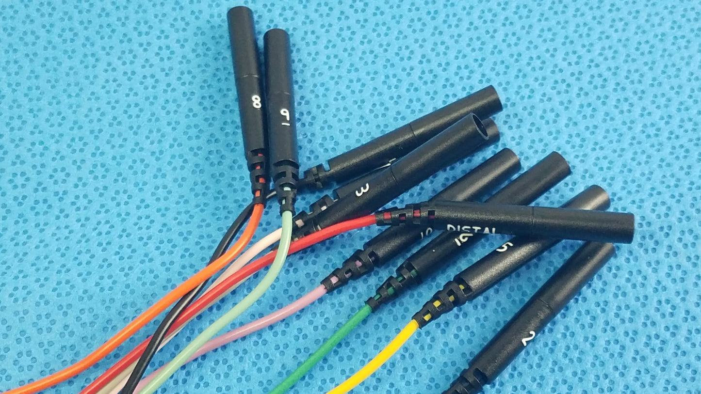 Black cylindrical connectors with numbered labels and colorful insulated wires on the reuse medical sjm st jude medical diagnostic connection cable