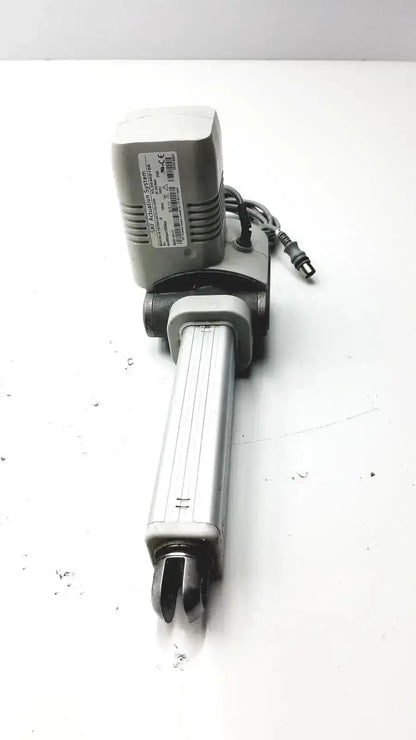 Gray and black skf actuation linear actuator with rectangular motor housing and metallic shaft from hospital surplus