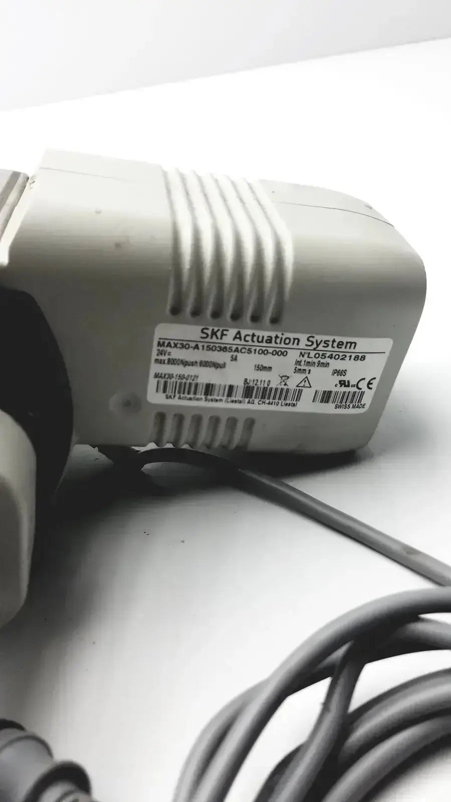 Gray plastic skf actuation system pump with ribbed texture and model number max30-a15036acs100-000 for linear actuator hospital surplus