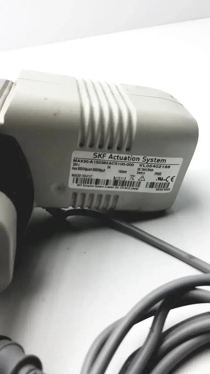 Gray plastic skf actuation system pump with ribbed texture and model number max30-a15036acs100-000 for linear actuator hospital surplus
