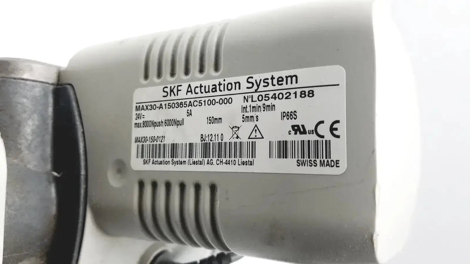 Gray metallic skf actuation system max30-a150365ac5100-000 linear actuator motor with technical specs and swiss made label for hospital surplus