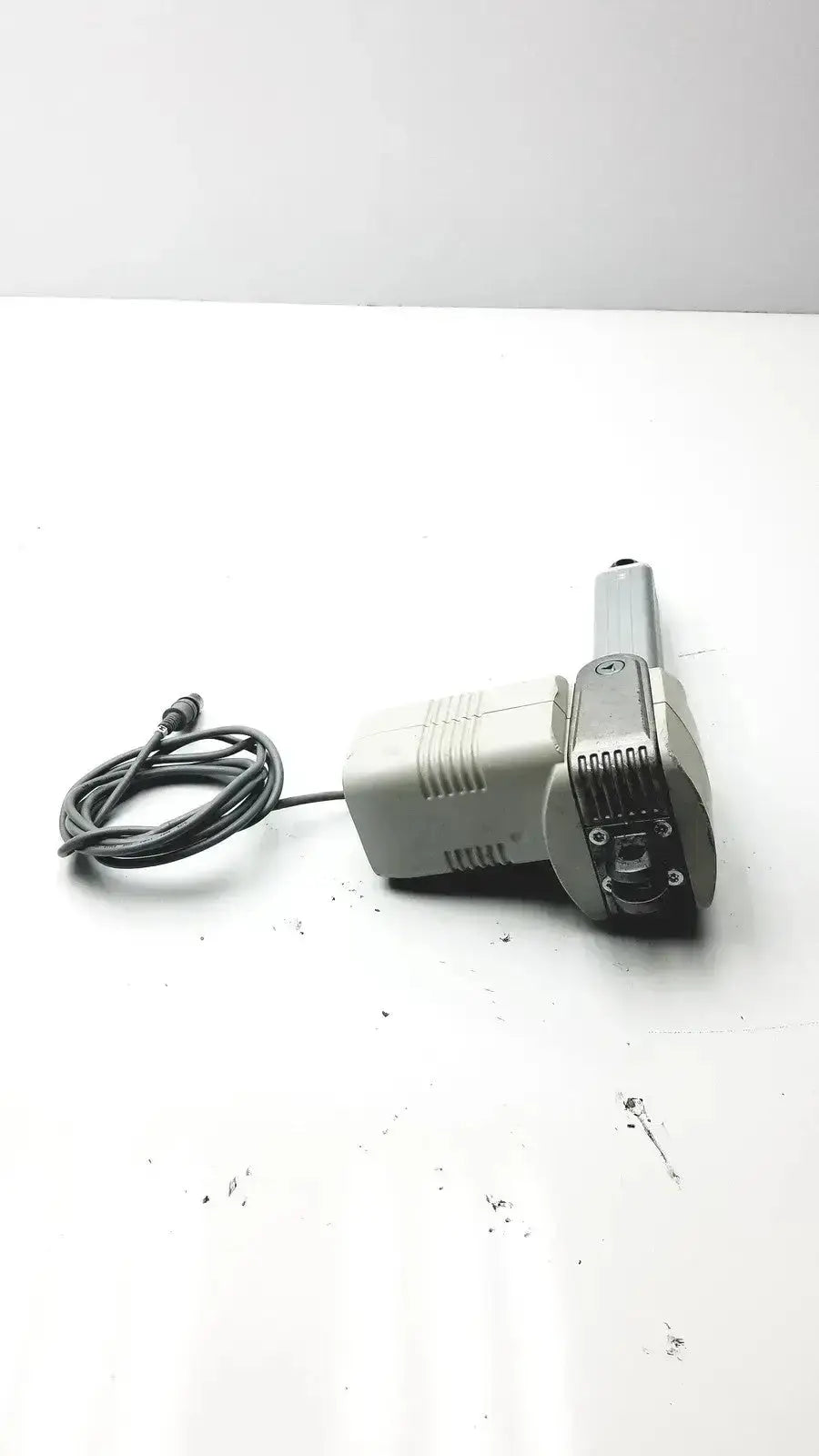 Gray plastic and metal electric drill with coiled black power cord for skf actuation hospital surplus linear actuator use