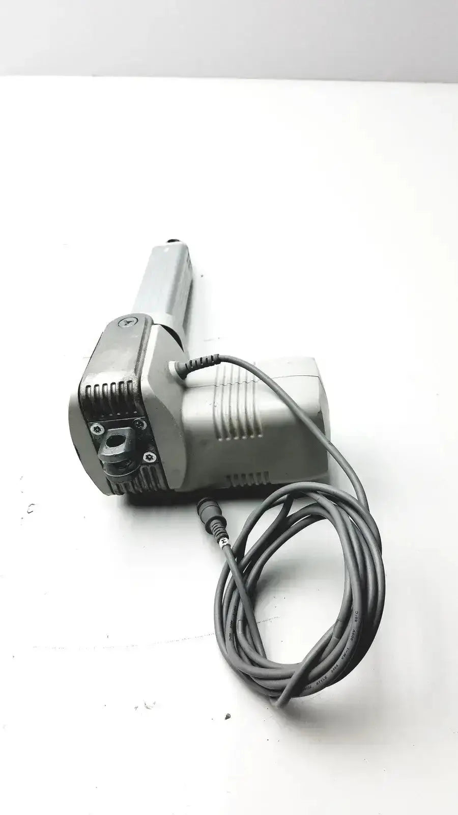 Gray metallic linear actuator with coiled power cord from skf actuation hospital surplus max30-a150365ac5100-000 system