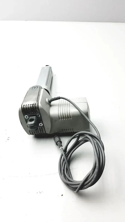 Gray metallic linear actuator with coiled power cord from skf actuation hospital surplus max30-a150365ac5100-000 system