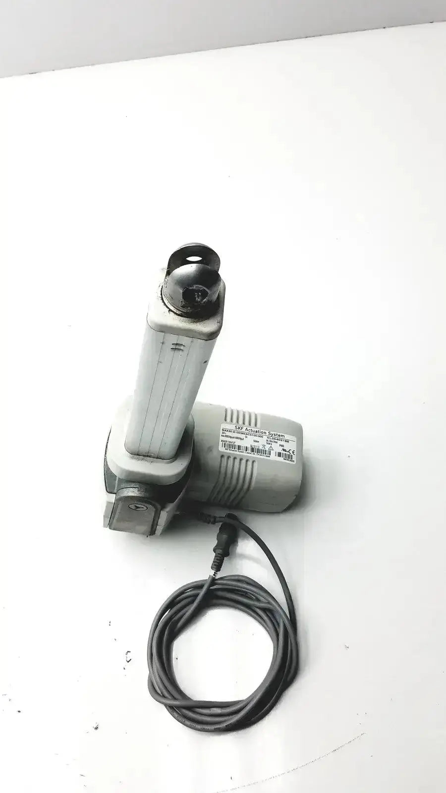 Gray cylindrical motor housing electric gate operator with power cord for skf actuation linear actuator hospital surplus