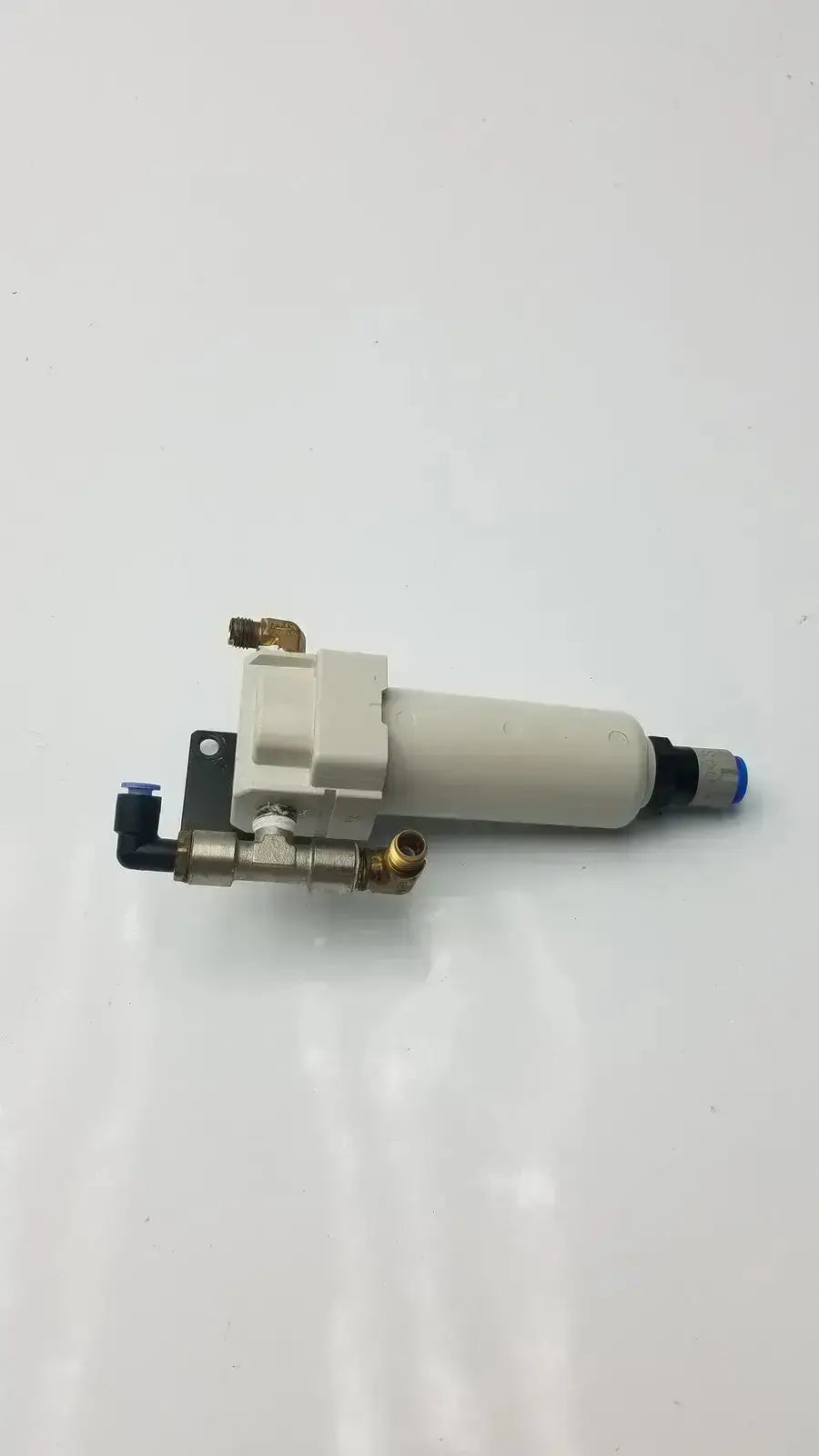 White cylindrical smc fd30-n02c-2z-a air filter with brass fittings and black connectors rated for 150 psi max pressure