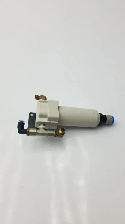 White cylindrical smc fd30-n02c-2z-a air filter with brass fittings and black connectors rated for 150 psi max pressure