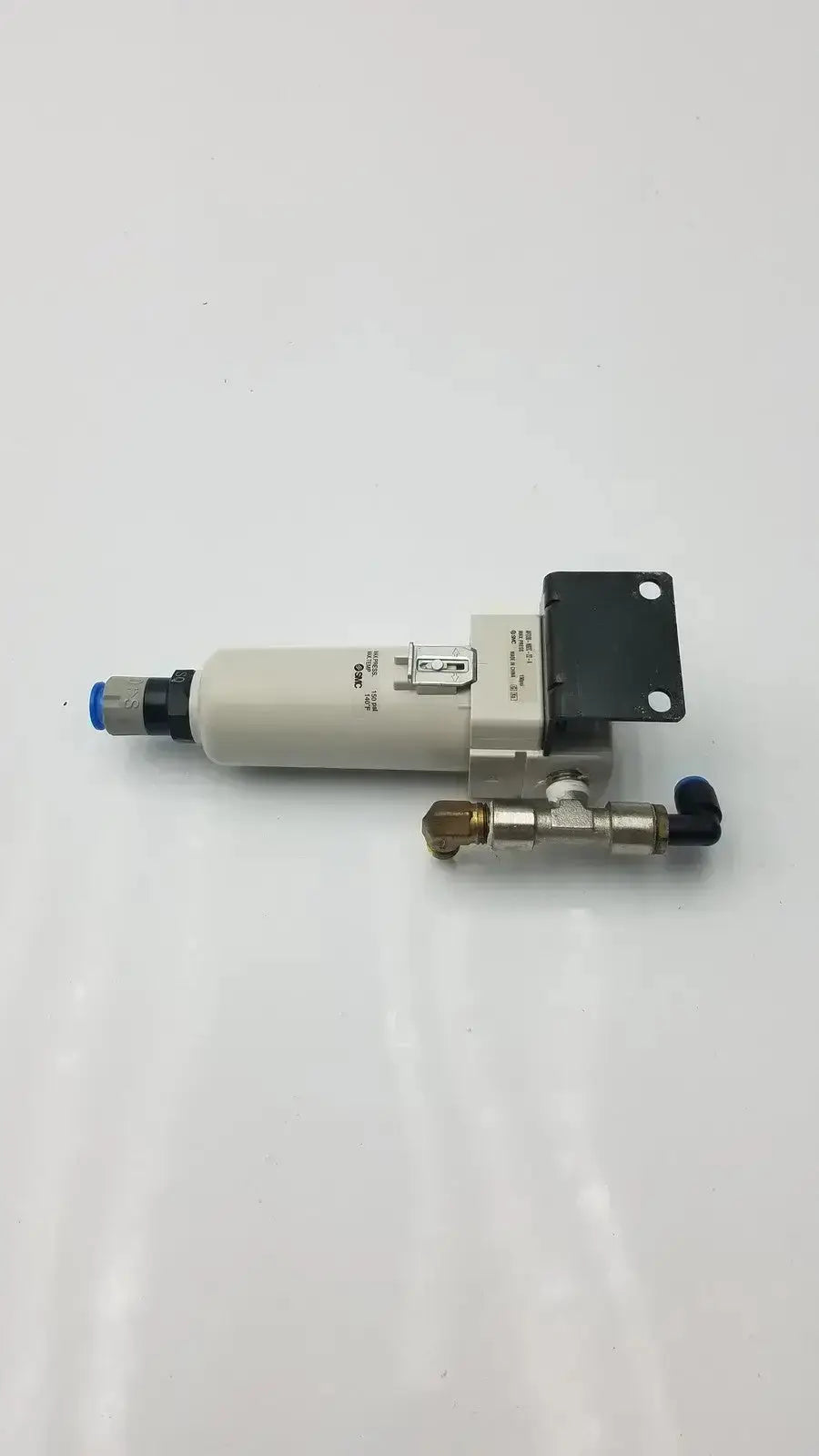 Industrial air filter smc fd30-n02c-2z-a with beige cylindrical body, metallic fittings, blue caps, and 150 psi max pressure