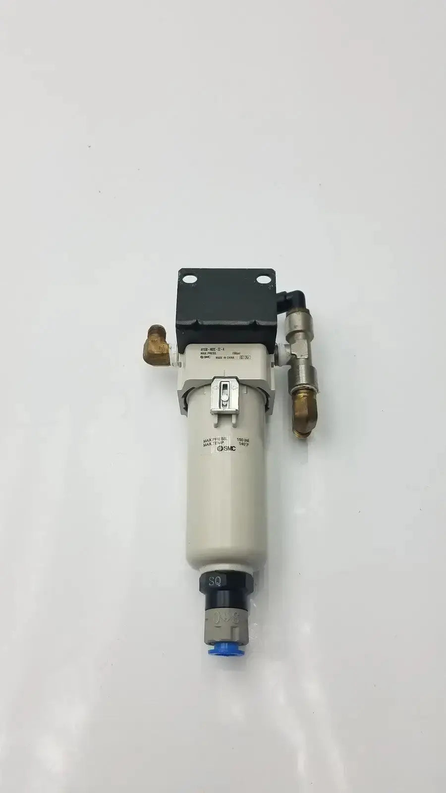 Gray cylindrical smc fd30-n02c-2z-a air filter with black bracket and brass fittings rated for 150 psi max pressure