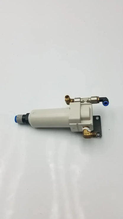 Smc fd30-n02c-2z-a white cylindrical air filter with brass fittings blue caps and 150 psi max pressure rating