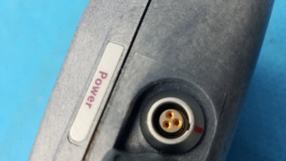 Gray metallic power adapter with white power button and gold three-pronged connector for smiths medical infusion pump medical equipment