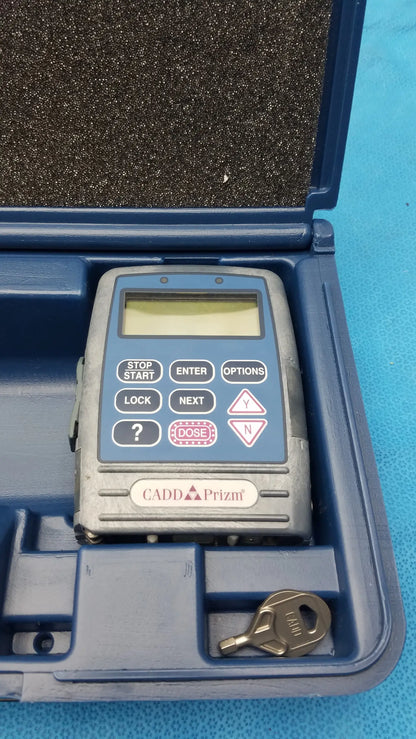 Smiths medical 6100 cadd prizm ambulatory infusion pump with gray handheld radiation detector in blue protective case medical equipment