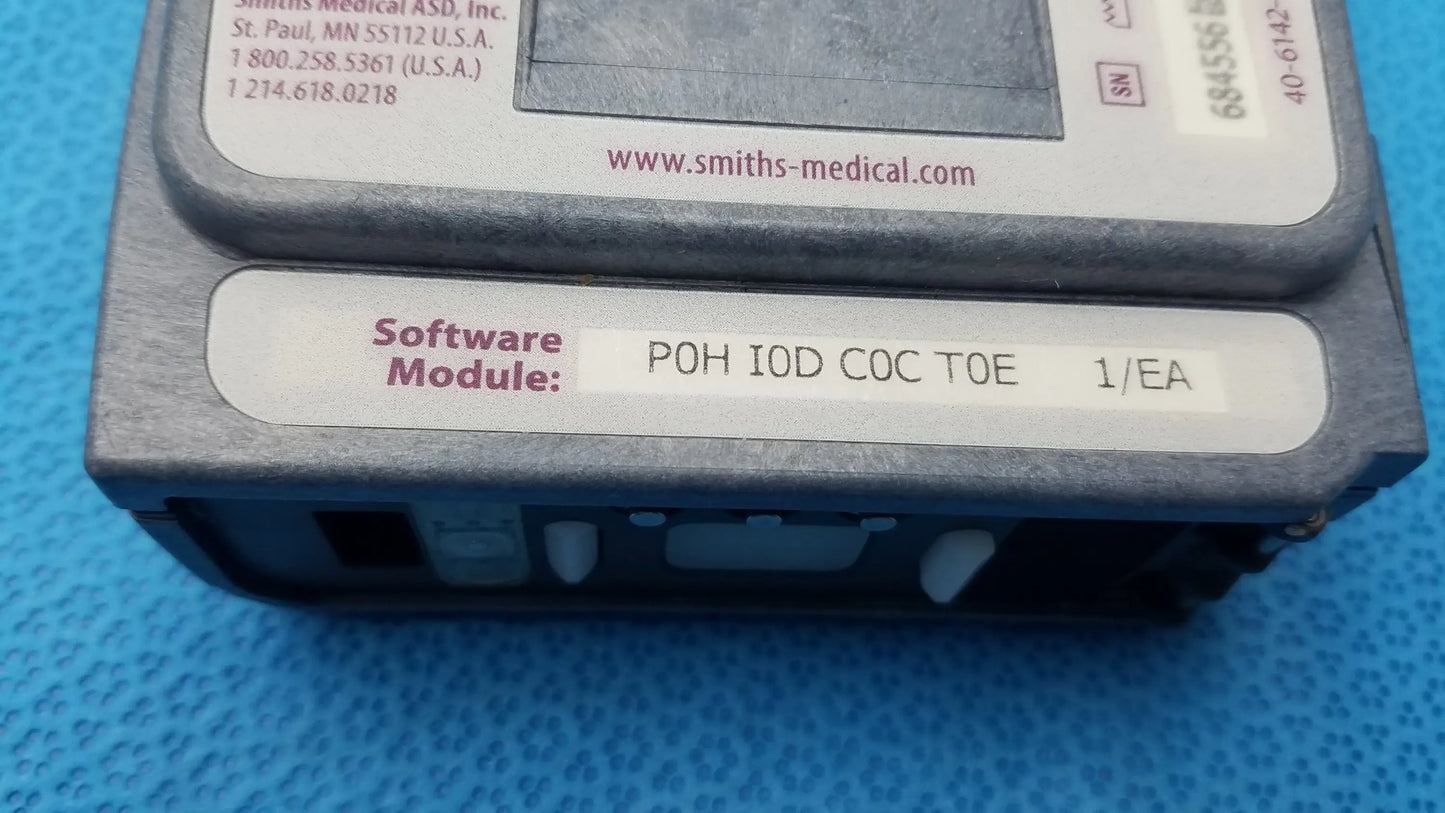 Gray plastic software module labeled poh iod coc toe 1/ea from smiths medical asd for smiths medical 6100 cadd prizm infusion pump medical equipment