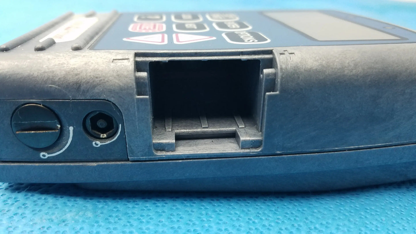 Blue plastic handheld medical equipment with keypad and card slot smiths medical 6100 cadd prizm ambulatory infusion pump