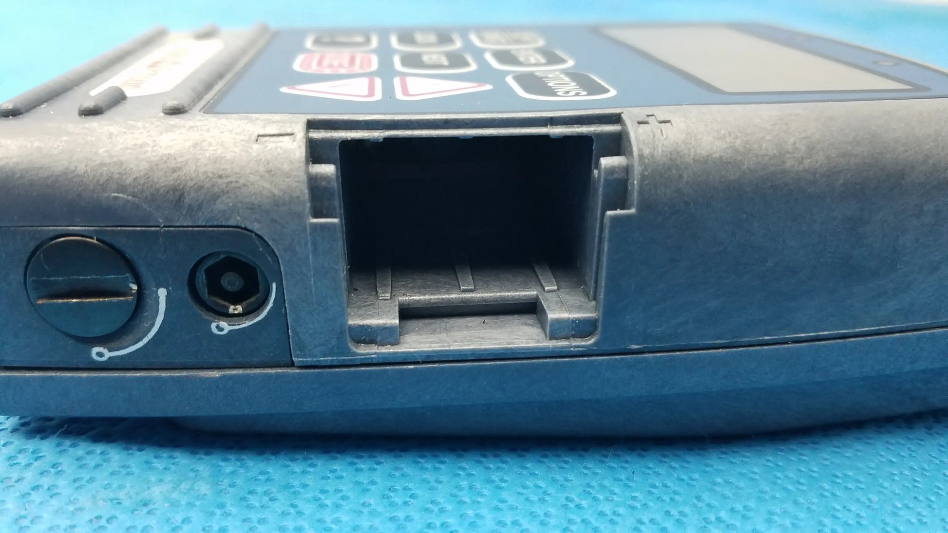 Blue plastic handheld medical equipment with keypad and card slot smiths medical 6100 cadd prizm ambulatory infusion pump