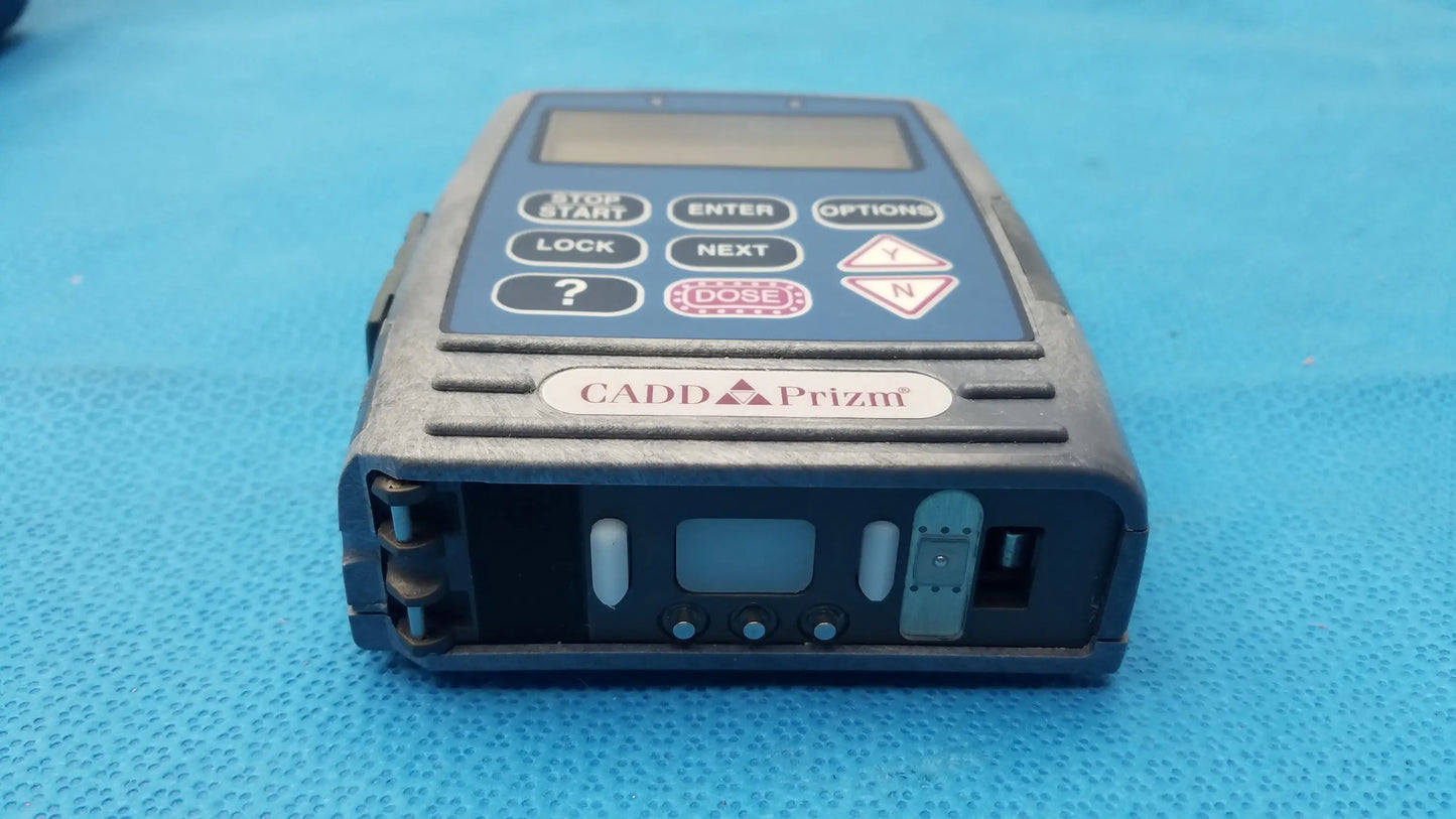 Black cadd prizm handheld radiation dosimeter with digital display and buttons used in medical equipment applications
