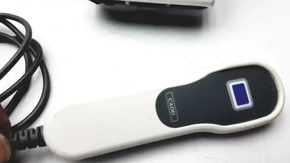 White and black handheld smiths medical cadd-solis device with blue display screen featuring cadd logo on its side