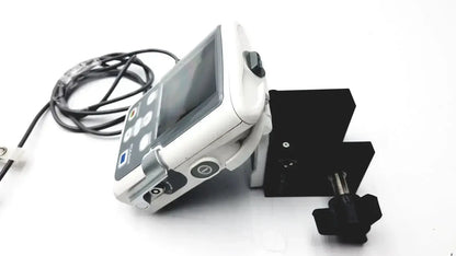 White medical ultrasound machine smiths medical cadd-solis 2110 with black control buttons and polemount adapter