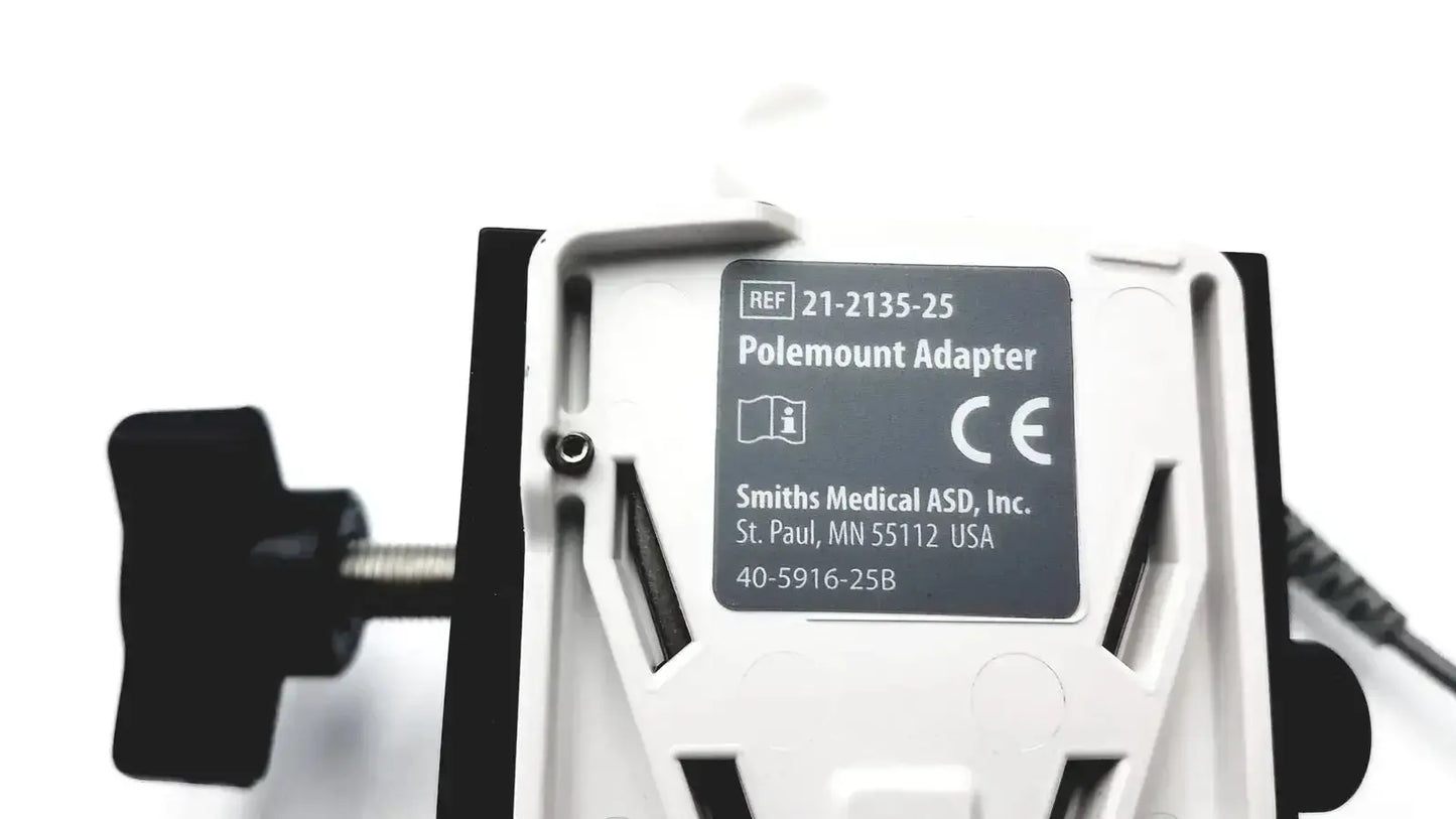 White plastic smiths medical cadd-solis polemount adapter with black accents and labeled smiths medical asd inc
