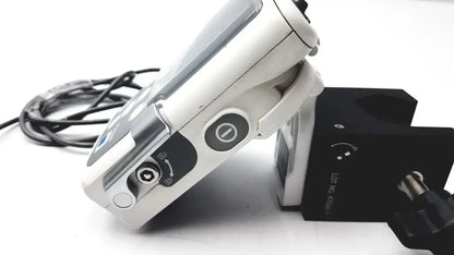 White and silver smiths medical cadd-solis endoscope with black buttons and coiled cable shown with polemount adapter and remote