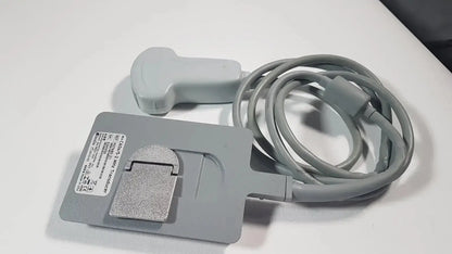 Gray sonosite c60x 5-2 mhz ultrasound transducer p07680-21 with coiled cable and silver metallic base plate shown from the back