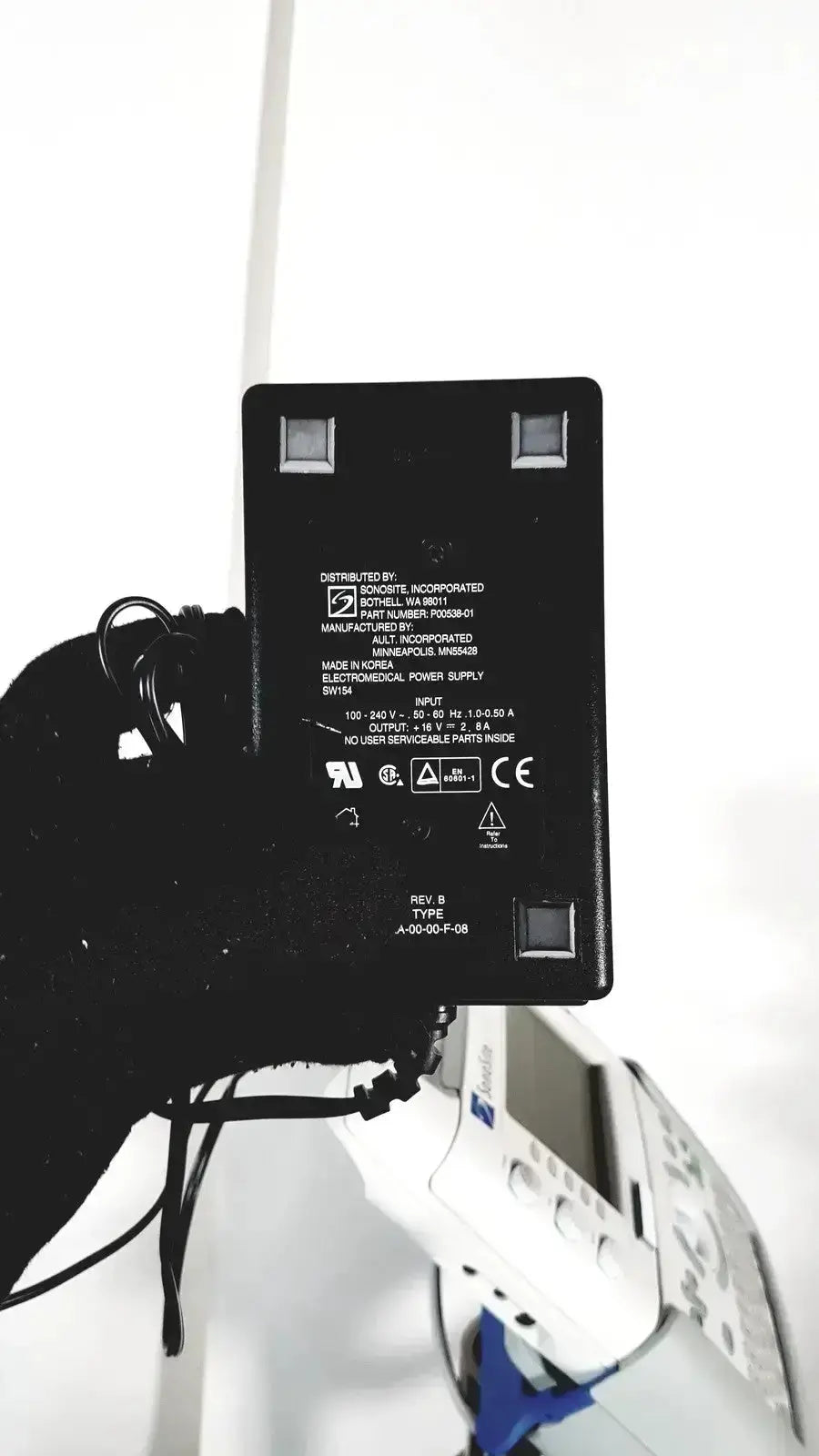Black rectangular power adapter with silver terminals and white specs for sonosite l38 10-5 mhz linear transducer with stand