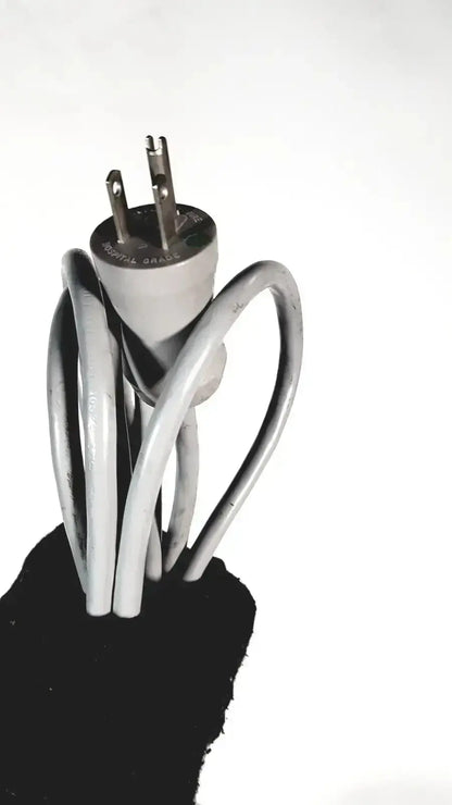 A white electrical plug with three prongs wrapped in a coiled gray cord for sonosite l38 10-5 mhz linear transducer