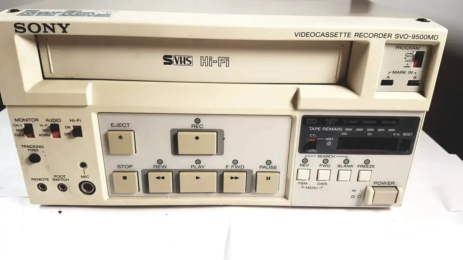 Cream-colored sony svo-9500md medical svhs vhs videocassette recorder with beige buttons and digital display panel