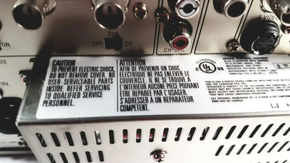 Silver metal audio receiver with input/output ports and caution label on the back of sony svo-9500md medical svhs