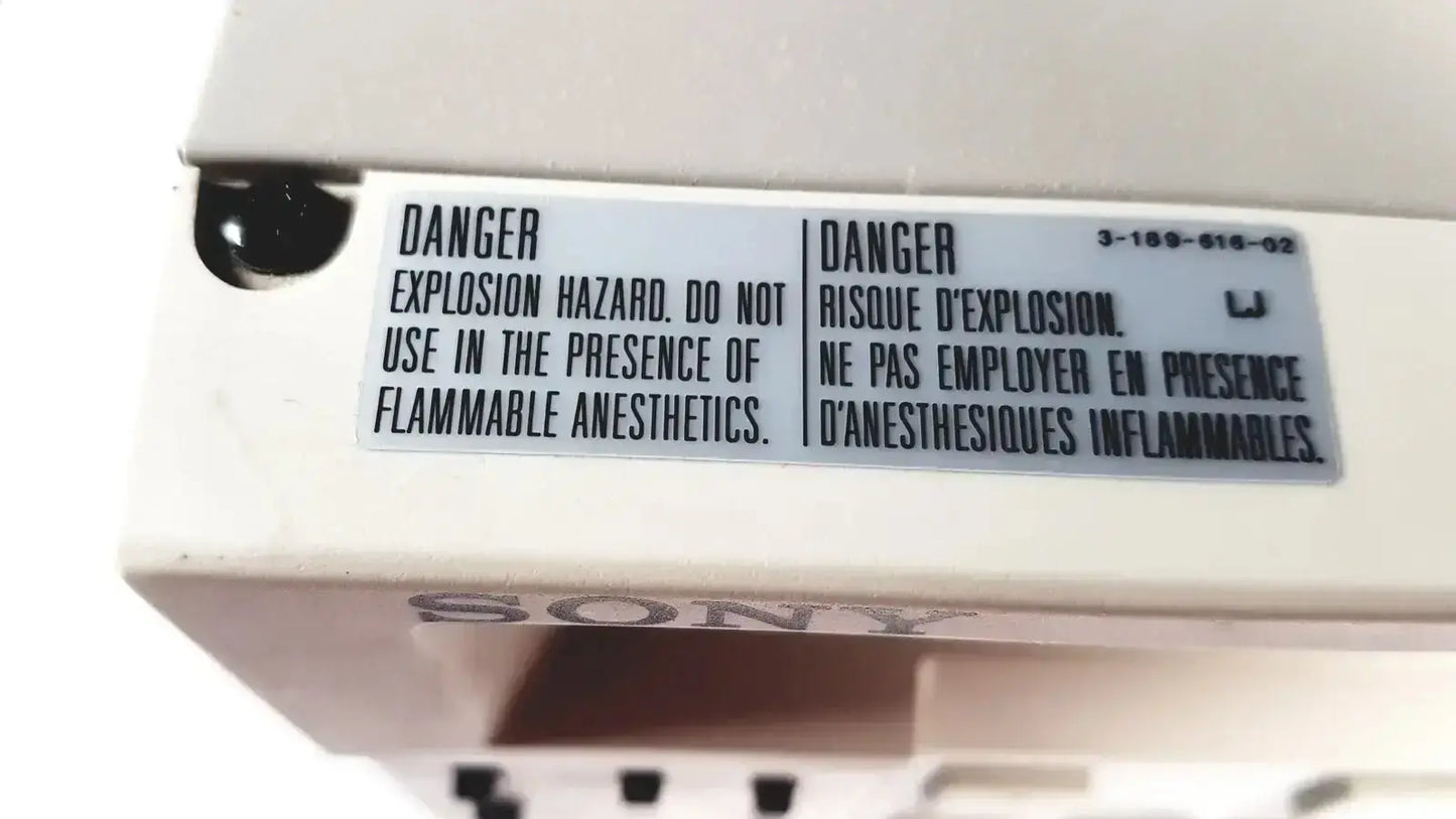 White sony svo-9500md medical svhs vhs videocassette recorder with bilingual safety warning label on front panel