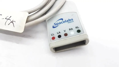 White plastic spacelabs medical 700-0008-06 medical cable with labeled electrodes and color-coded indicator lights for hospital surplus