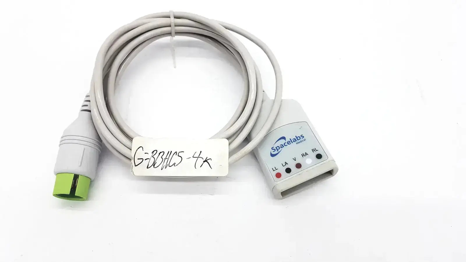 Gray spacelabs medical cable with green connector and labeled tag from spacelabs medical 700-0008-06 hospital surplus
