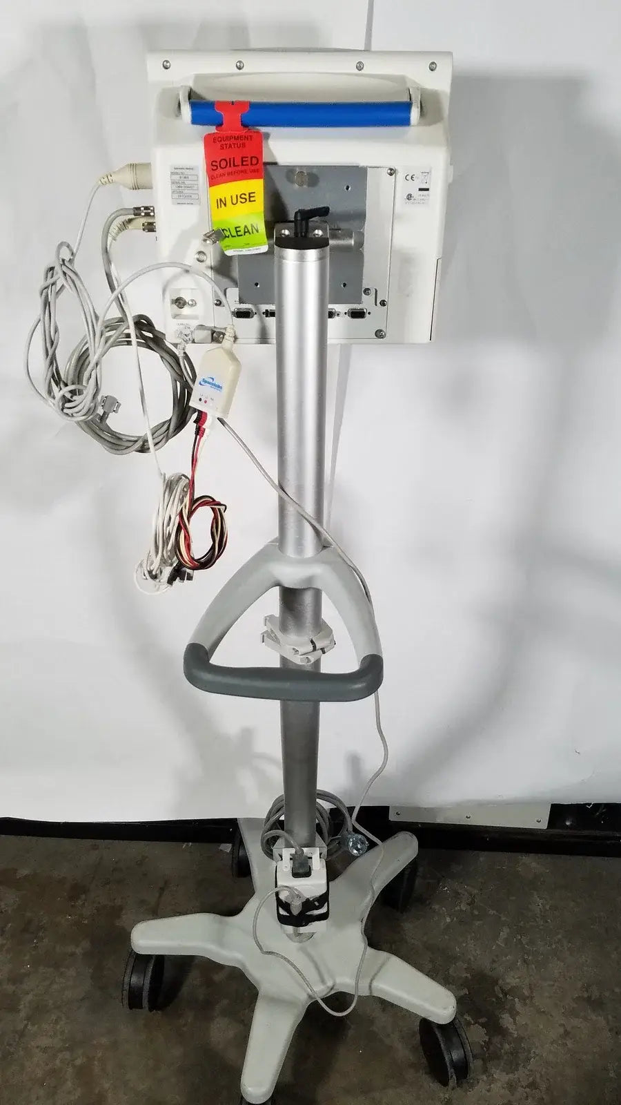 Silver and gray spacelabs SL 91369 Ultraview patient monitor with rolling stand and wheels for medical equipment use