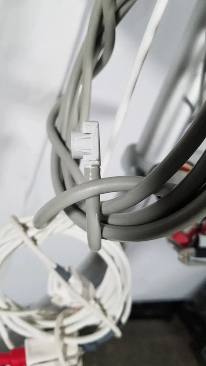 Gray network cable with white rj45 connector on the back of spacelabs sl 91369 ultraview patient monitor with rolling stand medical equipment