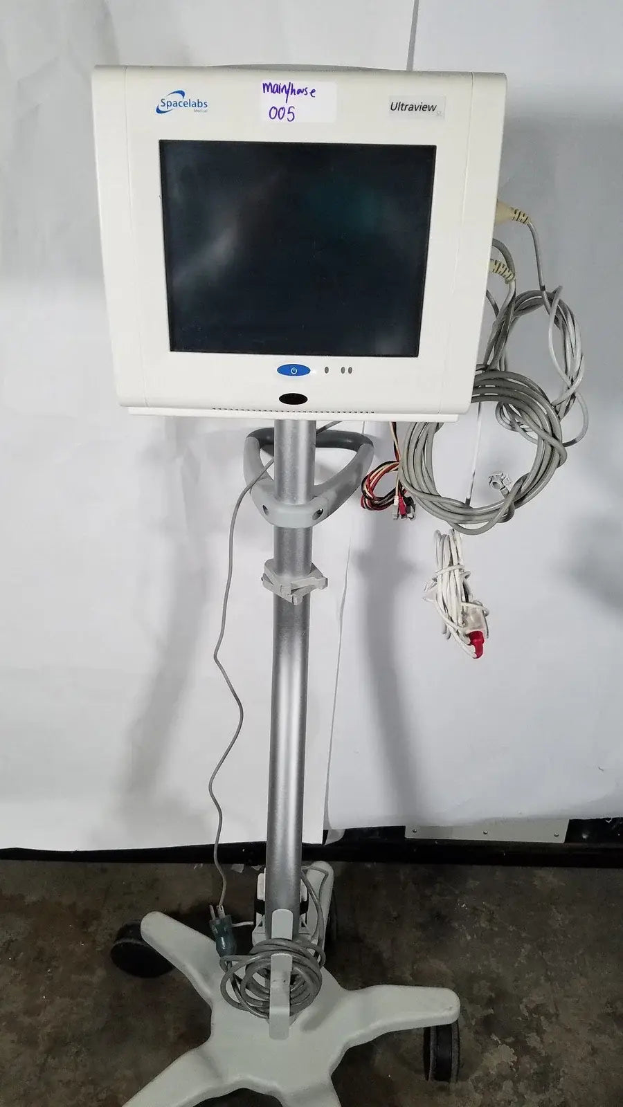Spacelabs SL 91369 Ultraview patient monitor in white mounted on a silver rolling stand for medical equipment use