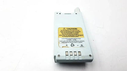 White plastic li-ion rechargeable wireless battery module with yellow caution label and four rectangular contact ports