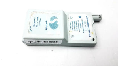 Gray plastic spectrum wireless battery module with blue fingerprint logo and white labeling for ieee 802.11b use
