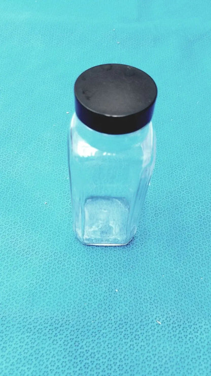 Clear glass square glass bottle with black plastic lid for laboratory reagent or reuse medical equipment storage