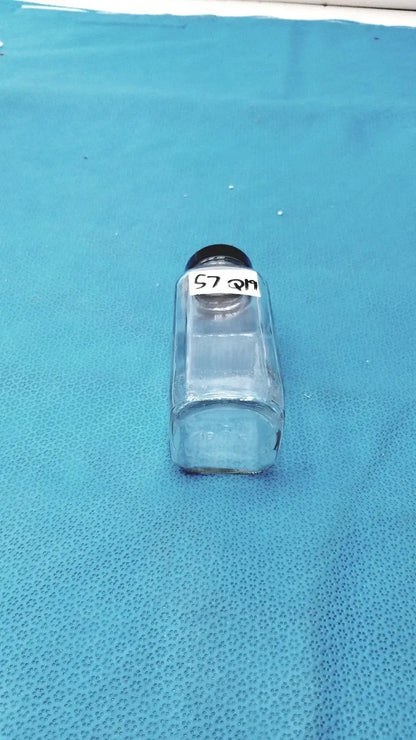 Square clear glass bottle with black lid and white label for medical equipment reuse and laboratory reagent storage