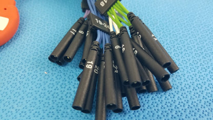 Black cylindrical heat shrink tubing with white numerical markings on St Jude Medical IBI-85931 diagnostic connecting cable