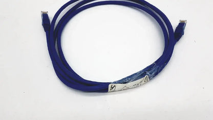 Blue startech.com cat 6 utp patch cable with rj45 connectors and a white label wrapped around its middle