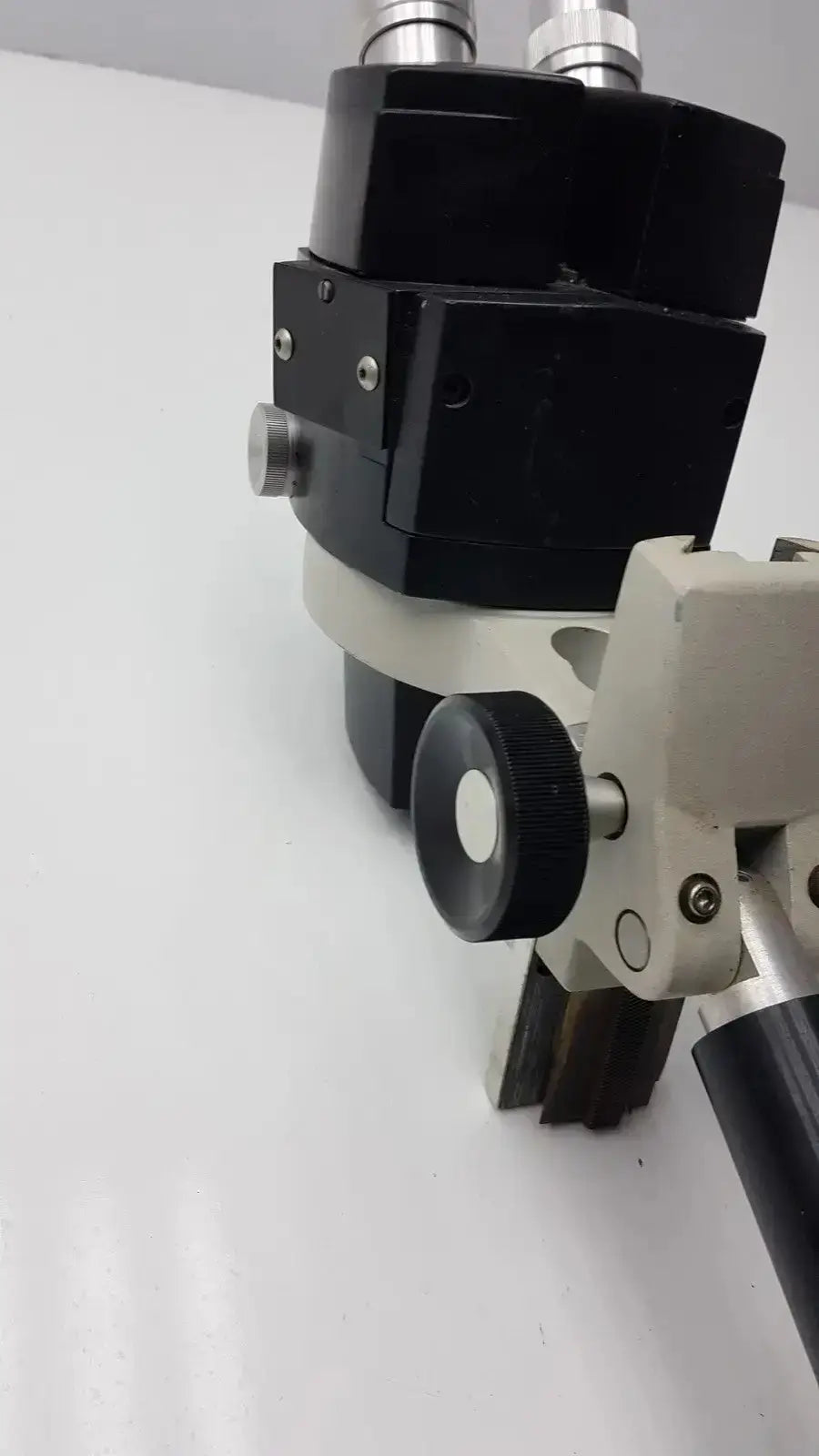 Black and silver reichert stereo star zoom microscope with adjustable focus knobs and sturdy industrial design
